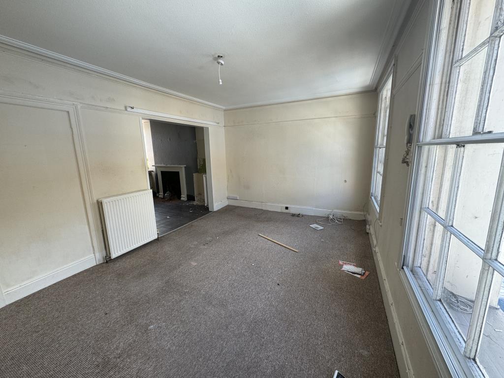 Lot: 58 - THREE STOREY TERRACED HOUSE FOR IMPROVEMENT - view on the first floor living room